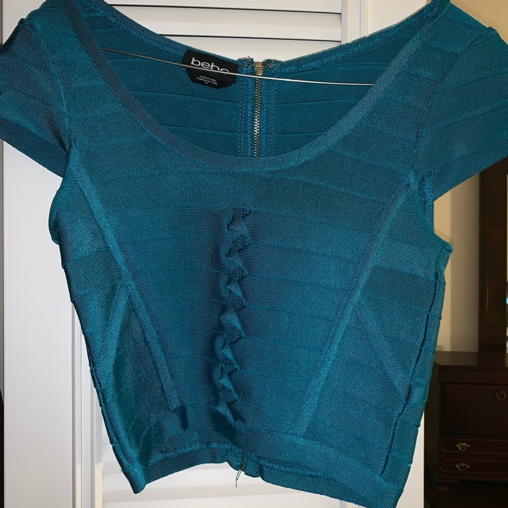 Turquoise crop top with small cut outs